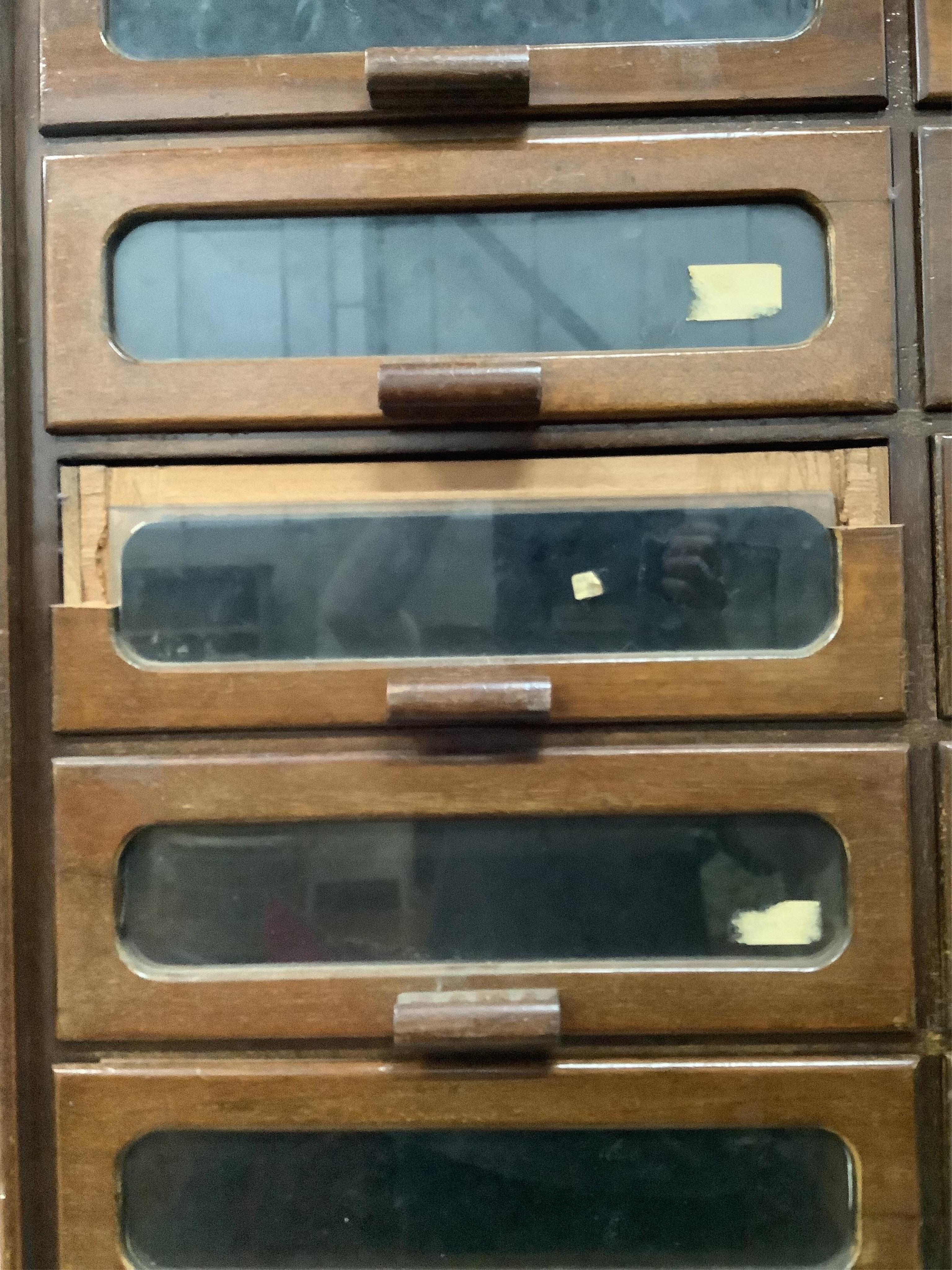 A large mid century mahogany haberdasher's cabinet, width 183cm, depth 50cm, height 199cm. Condition - poor